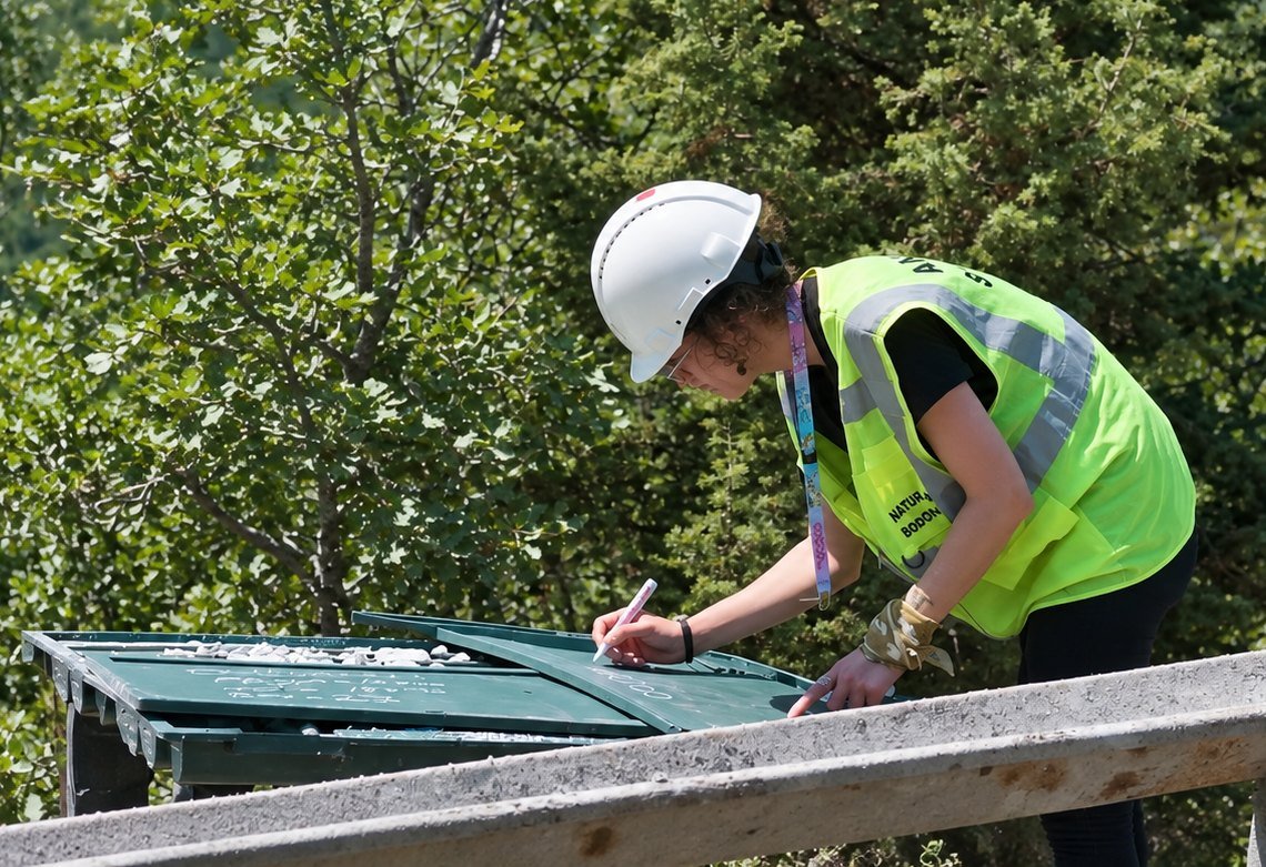 Geologist logging core at the drill site